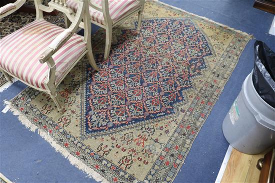 A Caucasian red, blue and cream ground rug 190 x 130cm.